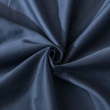 The Luxe Cotton Sateen Flat Sheet - Midnight by Linenly features rich dark blue fabric with soft, spiral folds that create subtle highlights and shadows—ideal for luxury bedding with a visually textured, elegant finish.